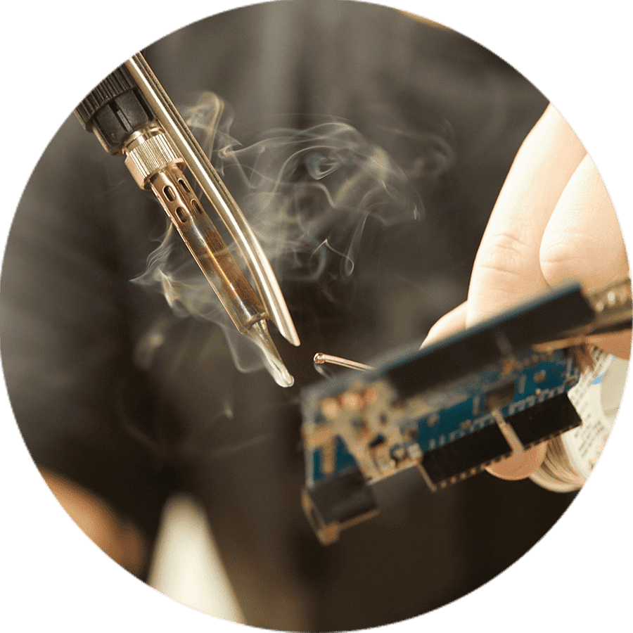 a student soldering electronics