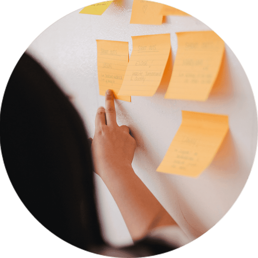 a student pointing at notes on a board