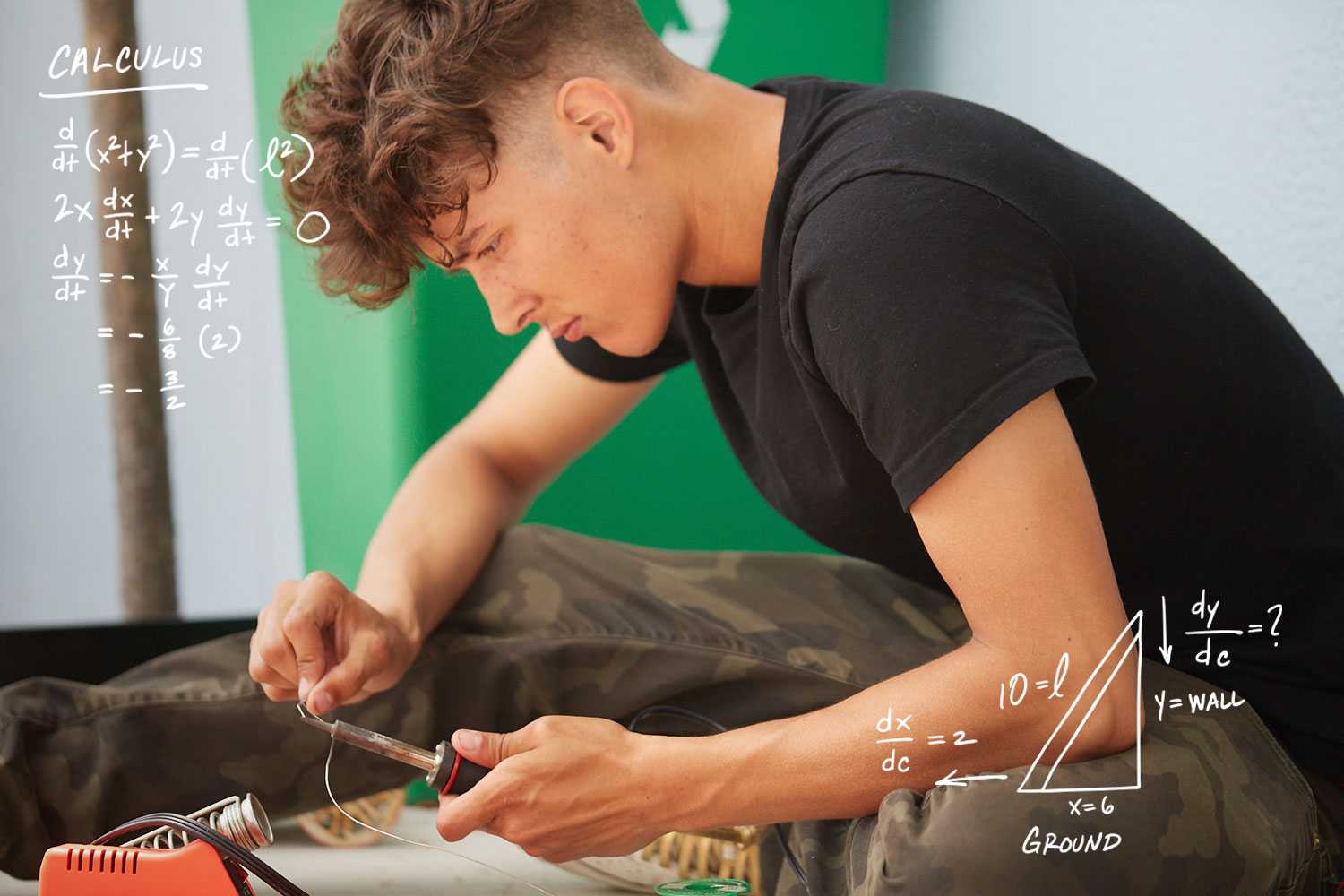 a student working with a soldering iron