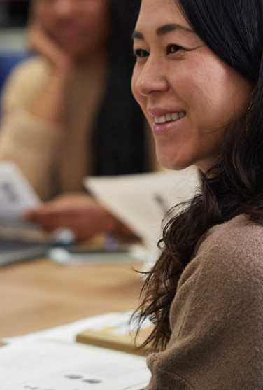 A small group of students gathered at a table