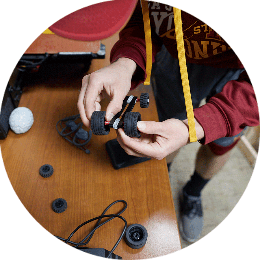 student building a small car
