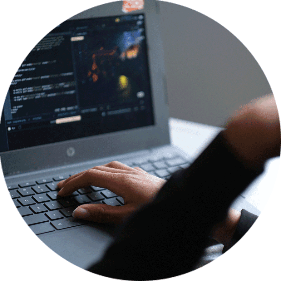 a student's hands on a laptop keyboard