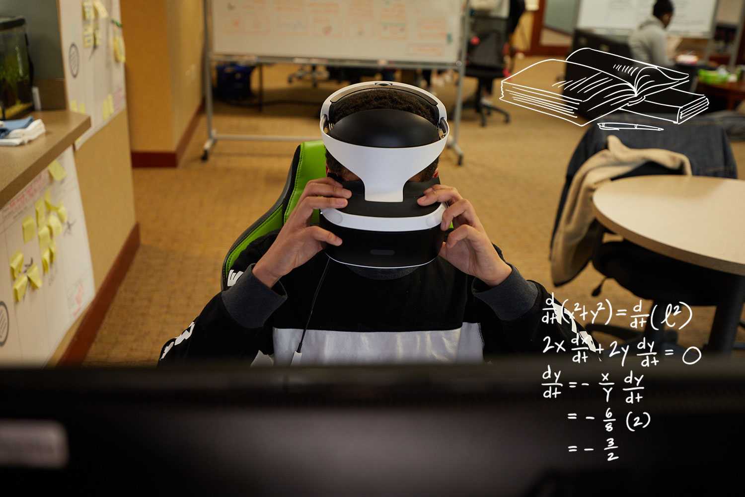 a student looking through VR goggles